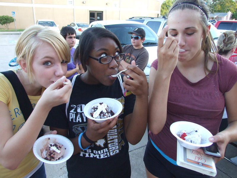 Image: Is that Blue Bell or Blue Bunny? — Sierra Harris, Chante Birdsong and Brianna Perry enjoy the icy treat on a hot summer’s day.