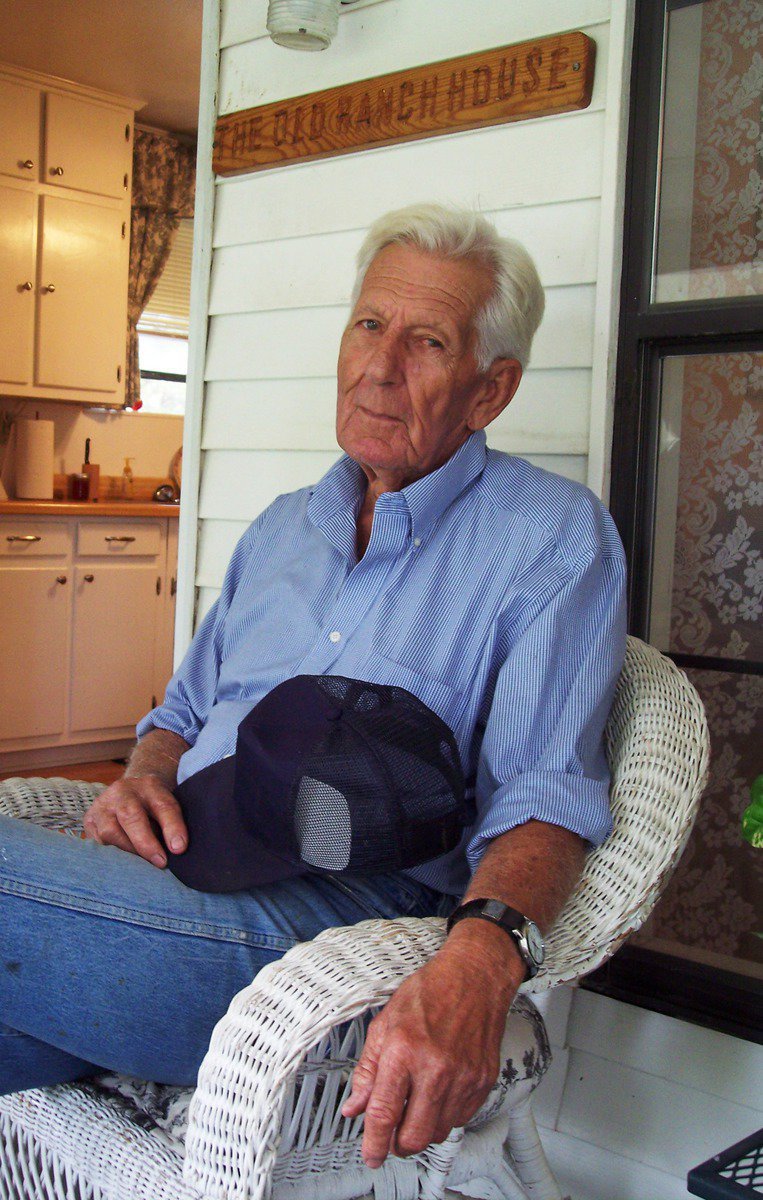 Image: Ed Dawson — Ed Dawson relishes his rustic roots on the front porch of his home.