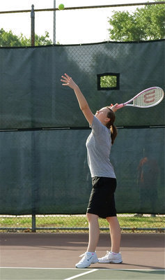 Image: The Germanator — Lisa Olschewsky displays her serving form she has been work hard at improving since last season.