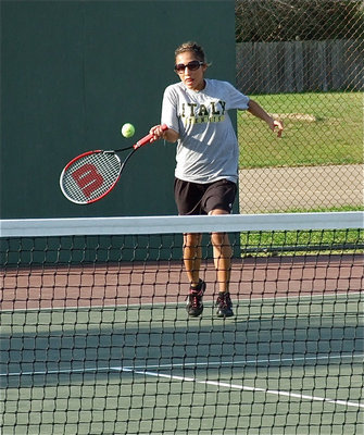 Image: Court diva — Jessica Hernandez returns a shot during her singles match.