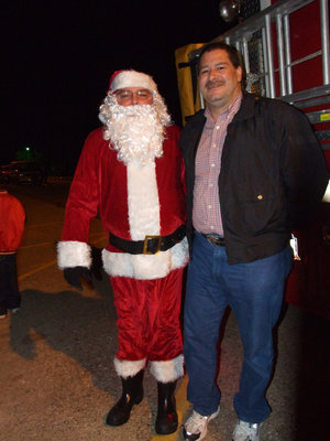 Image: Santa and Carlos Phoenix — Santa and Carlos Phoenix(chief of Milford police department) welcomes Santa.