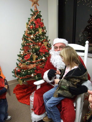 Image: Christmas Secrets — Santa listens to all her Christmas wishes.