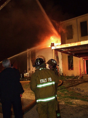 Image: Teaming up — Fire departments worked collectively to contain the fire.