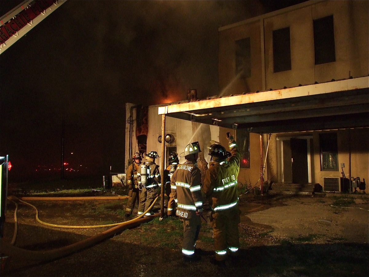 Image: Challenging fire — Fire threatens to consume the Nortex State Bank Building next door.