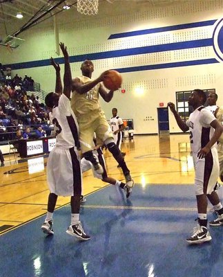 Image: Our turn — Jasenio Anderson(11) gives Hearne a taste of their own game plan and attacks the basket.