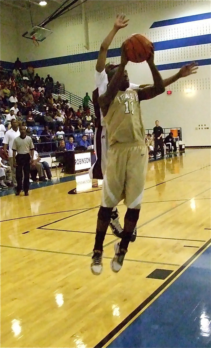 Image: Top flight — Jasenio Anderson(11) takes the battle to the air against the Hearne Eagles.