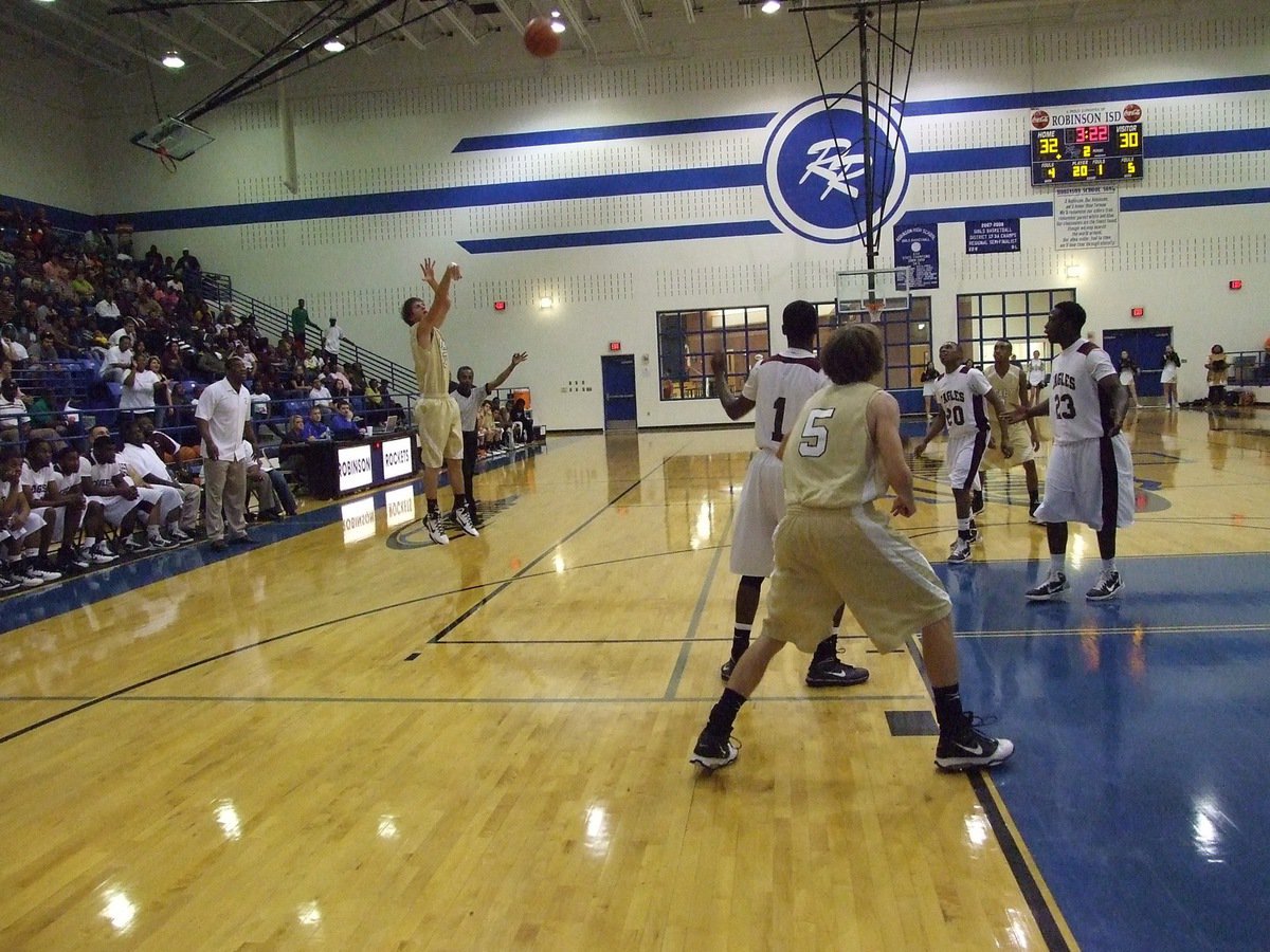 Image: For the lead… — Italy’s Jase Holden(3) launches a three-point attempt with Colton Campbell(5) underneath to rebound.