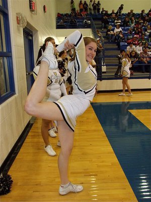 Image: Step it up — The athleticism on the court was matched by Italy High School Cheerleader Taylor Turner off the court.