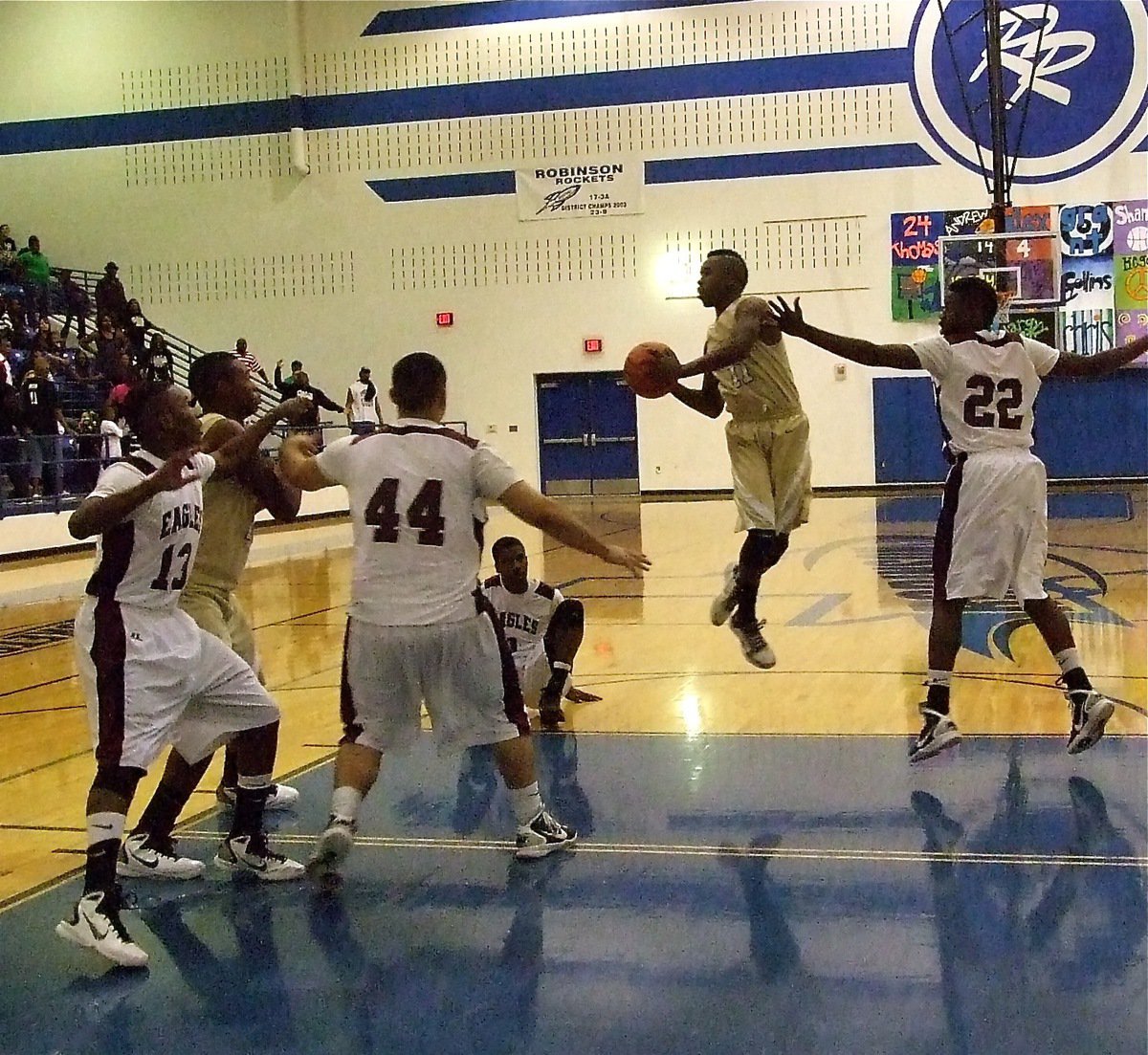 Image: PASSion — Surrounded, Jasenio Anderson(11) looks for help from his teammates.