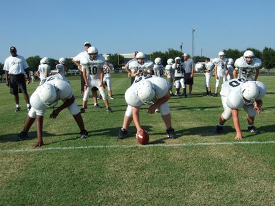 Image: Offense takes snaps — The Italy JH offense runs a few practice plays before the scrimmage against Hubbard.