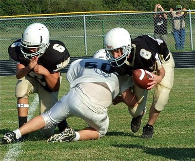 Image: Kyle tackles a Jaguar — Italy’s Kyle Fortenberry(50) dove for the loose ball but ended up with a tackle for a loss.