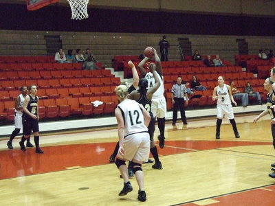 Image: Reed Scores Inside — Freshman Center #40 Jimesha Reed puts up a shot.
