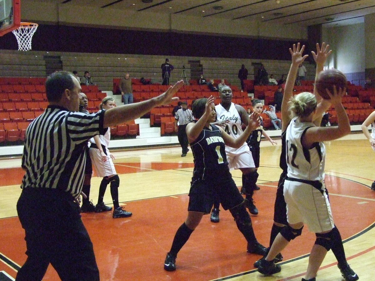 Image: Attempting To Pass — The Lady Gladiators did manage to improve on their passes into the post in their loss to Dawson.