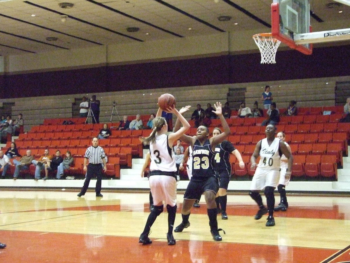 Image: Rossa Shoots — Freshman #3 Kaitlyn Rossa prepares to shoot over the Dawson defense.