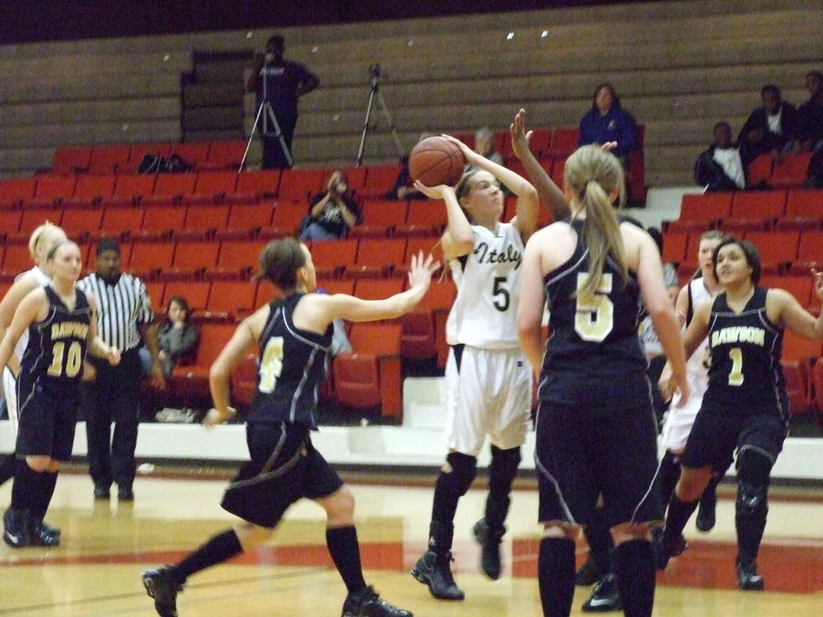 Image: DeMoss Goes Up Strong — Italy’s #5 Becca DeMoss is determined as she leaps for a score.