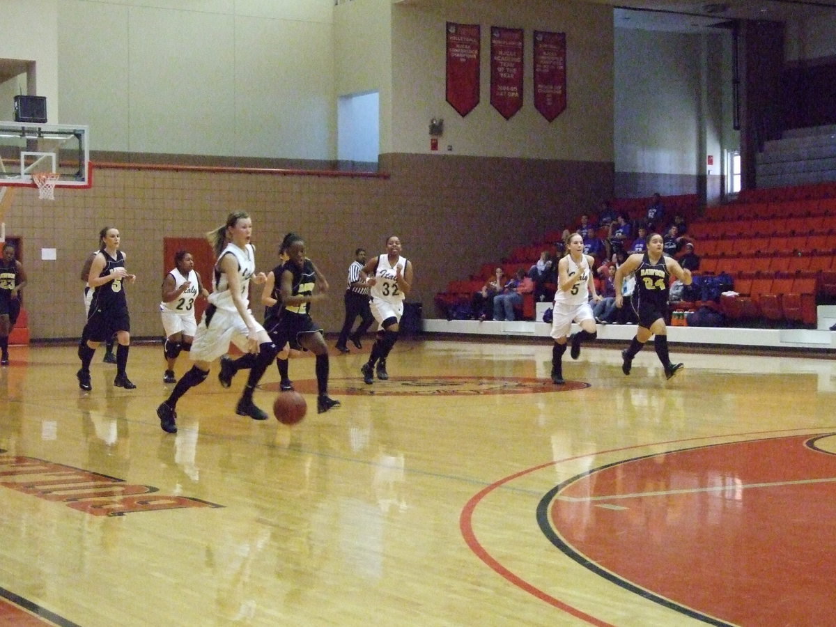 Image: Stealing The Momentum — Italy’s #3 Kaitlyn Rossa steals the ball and heads for the basket.