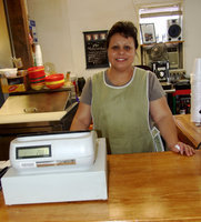 Image: Juana Martinez — Juana is right at home in front of the cash register at her family owned business, MaMa’s Place.
