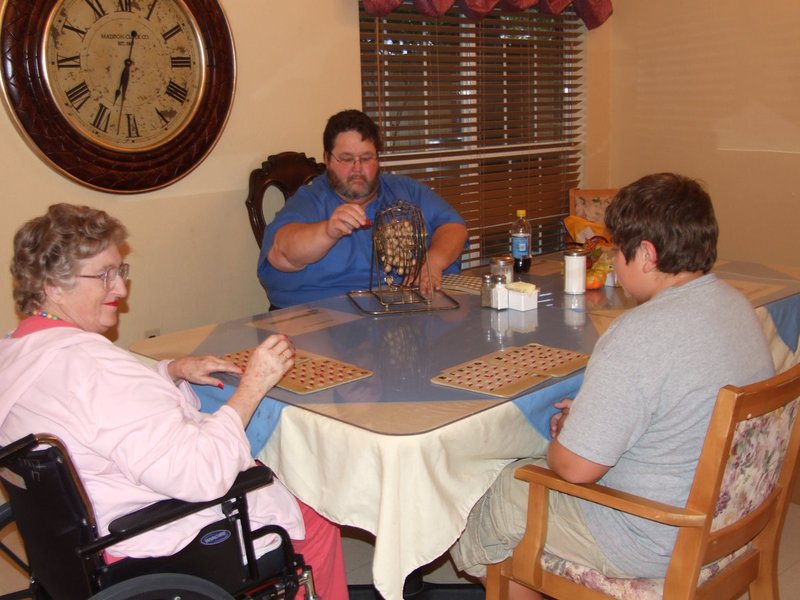 Image: Arval Gowin and players — Arval Gowin is busily calling out the letters for Bingo.