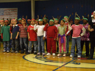 Image: Rudolph? — Singing Rudolph the Red Nosed being performed with lots of enthusiasm.