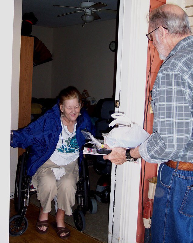 Image: Susie Hamilton of Waxahachie — Meals-on-Wheels volunteer Louis Sherwood delivers a meal to Susie Hamilton of Waxahachie.