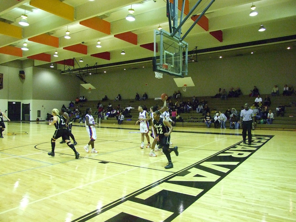 Image: Shay Scores — Italy’s #32 Shay Fleming scores a layup for the Lady Gladiators.