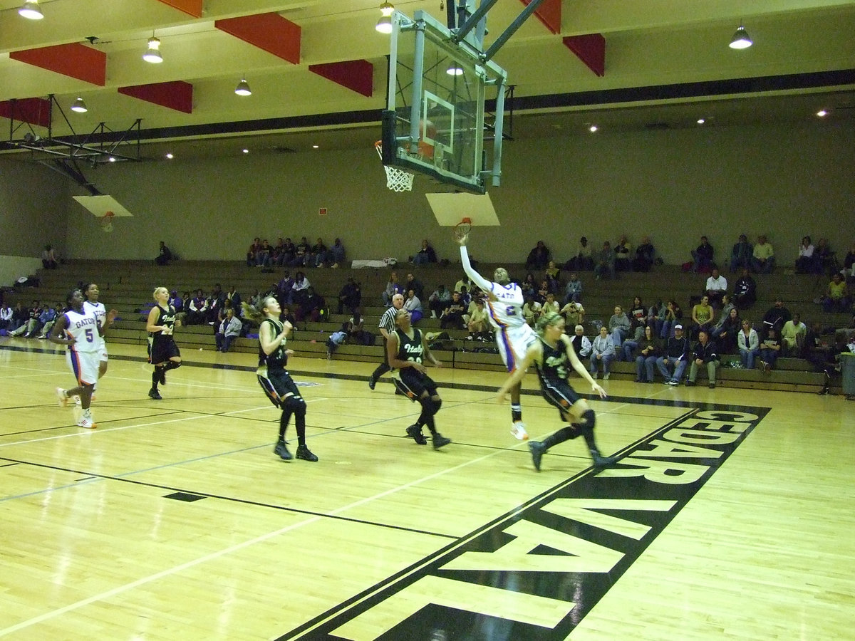 Image: DeMoss Distracts — Italy tries to distract a Gateway shooter flying in for a layup.