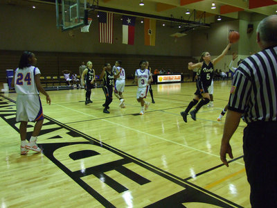 Image: DeMoss Steals — Up, up and away is Italy’s Becca DeMoss as she goes for a steal. Is that a “5” or an “S” I wonder?
