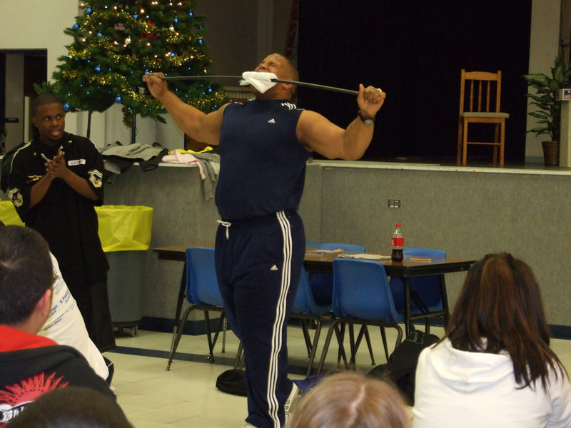 Image: Keith Davis bending metal — Keith was demonstrating that if you persevere all things can be done, even bending metal with your mouth.