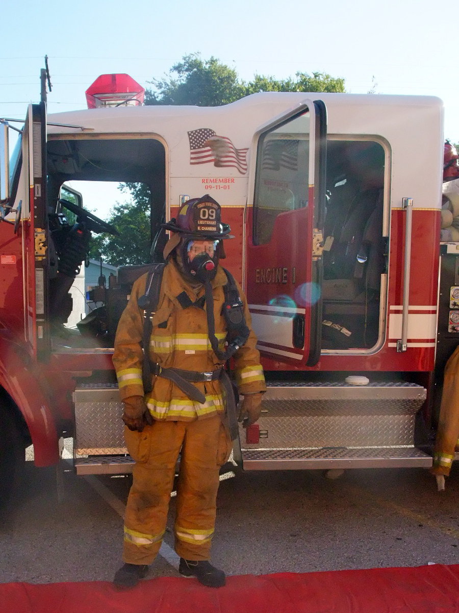 Image: Who Are You? — Fireman Chambers showed the students what he looks like in the gear and to let them know not to be afraid.