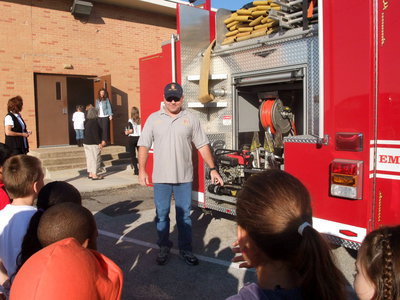 Image: Captain Jackie Cates — Captain Jackie Cates is showing the students the “jaws of life.”
