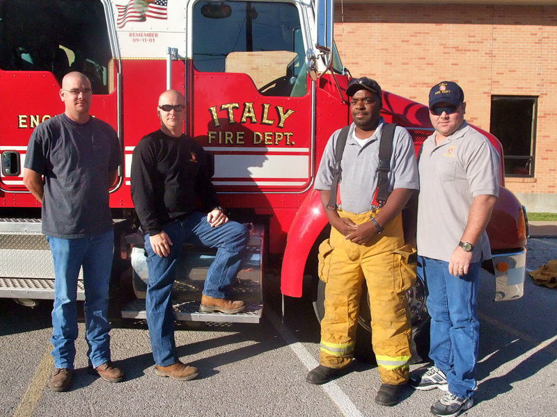 Image: Italy Fireman — These four firemen taught the students everything they need to know in case of a fire.