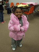 Image: Happy Coat Recipient — This cute little girl loves her new coat.