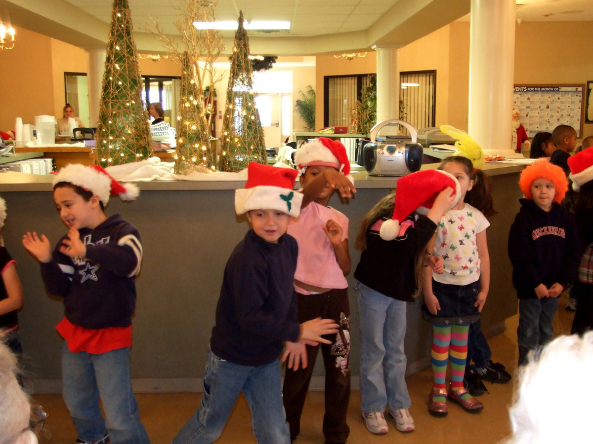 Image: Celebrate — Students singing with hand motions and all.