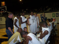 Image: Gladiators Get Refreshed — Coach Holley lets his players refresh before addressing the huddle. Coach Holley’s patience paid-off with a 2nd round win over All Saints 68-56 in the Italy Invitational Tournament. The win put Italy into the Championship game.