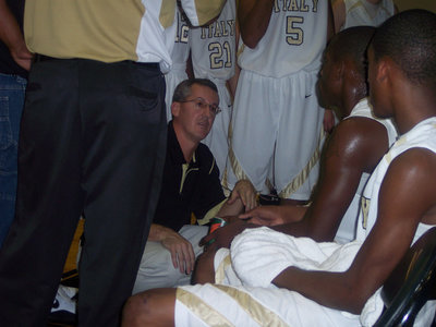 Image: Head Coach Kyle Holley — Coach Holley instructs his players during the timeout.