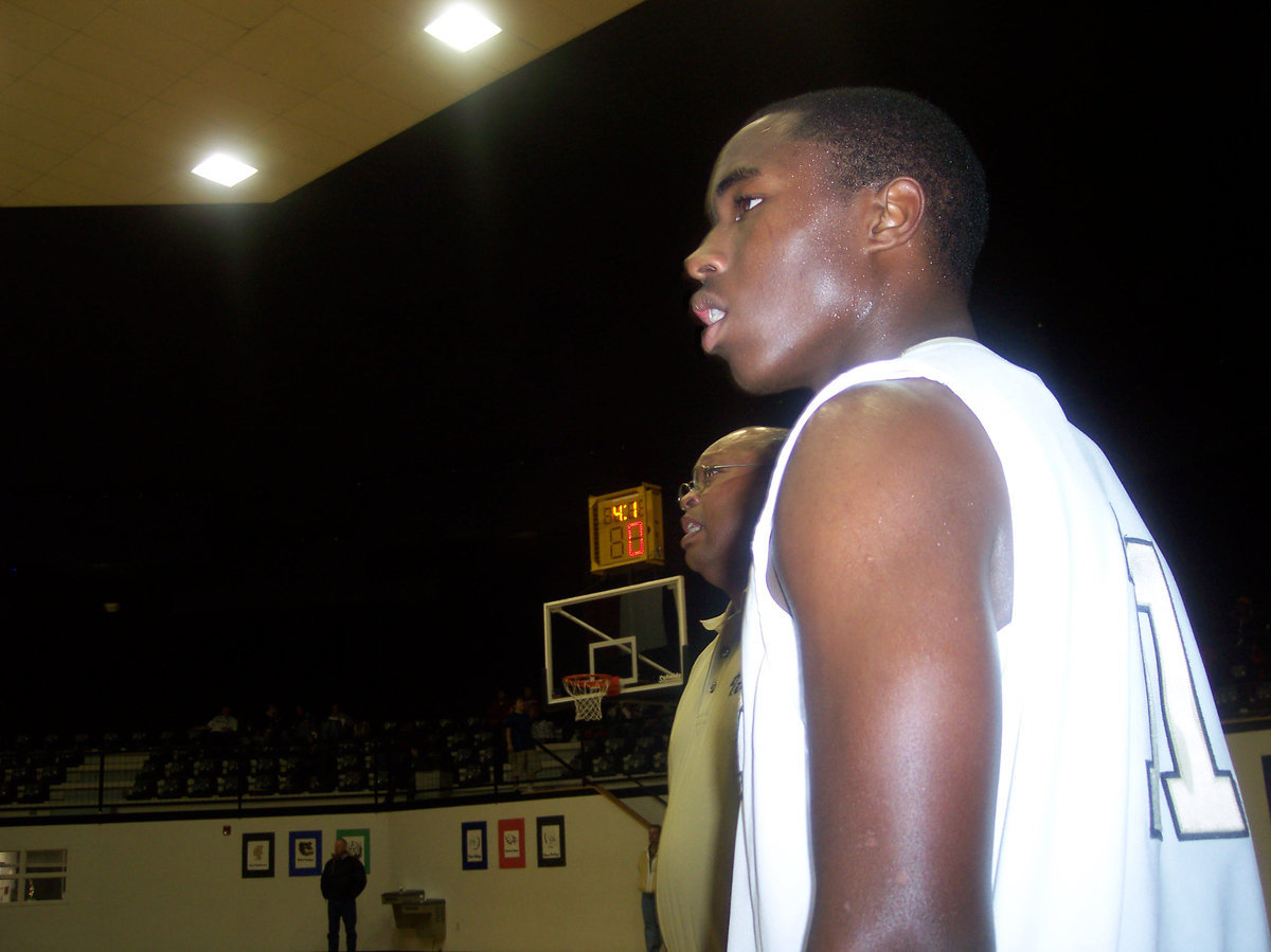 Image: Coach And Player — Italy Sophomore #11 Jasenio Anderson and Assistant Coach Larry Mayberry anxiously await the referees call during 2nd round action against All Saints.