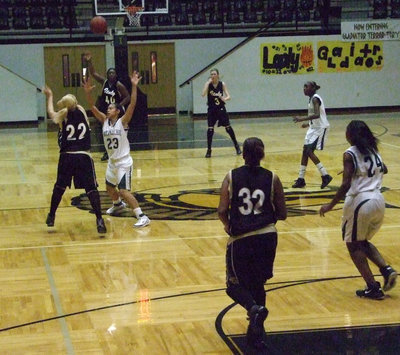 Image: Fast Break — Megan Richards #22 passes ahead to Jimesha Reed #40 hoping for an easy bucket.
