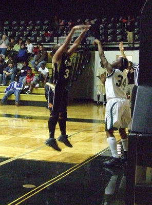 Image: Fleming Jumps — Italy Junior #32 Shay Fleming tries to deflect the inbound pass from Waxahachie.