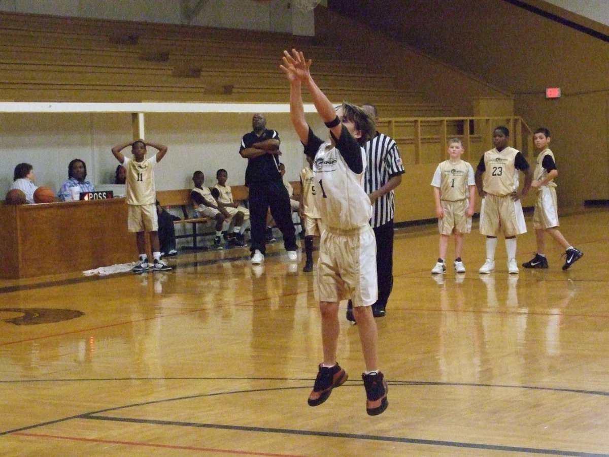 Image: Levi McBride — Levi McBride(1) shoots a technical foul shot.