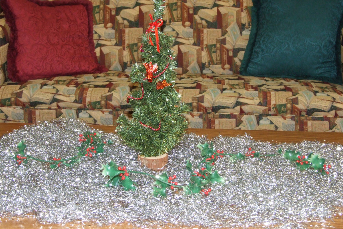 Image: Holiday decorations — Some of the students helped Mrs. Farmer decorate the library for the Christmas season.  There are lots of comfy places to read.