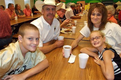 Image: Family event — Curtis and Michelle Riddle and their children Clay and Courtney enjoy some family time after their meal.