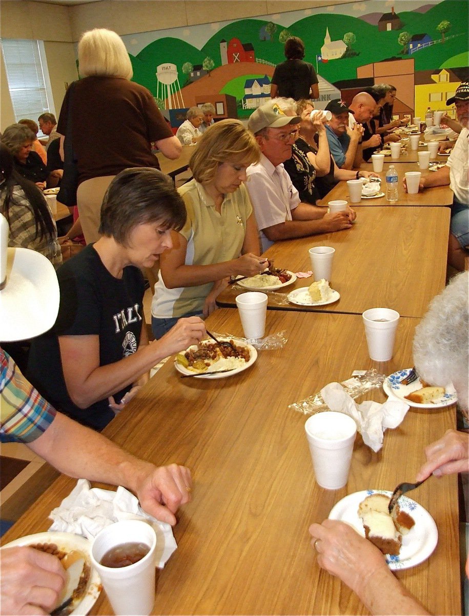 Image: All in the wrist — Guests visit while dining.