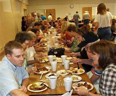 Image: Let’s dig in! — Everyone digs in to help the cause.