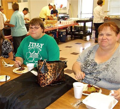 Image: Owens family enjoys BBQ — Logan Owens and mom, Pam, help support the scholarship.