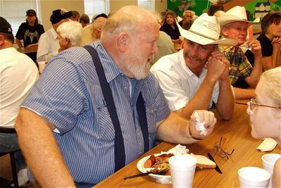 Image: Remember when… — Current Italy ISD School Board member Curtis Riddle visits with former Ag teacher Murrie Wainscott.