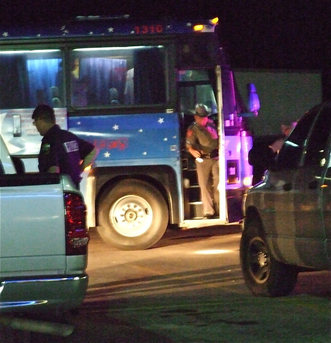 Image: Final inspection — Local police backup the State Troopers who helped catch a drug smuggler traveling down Hwy. 35.