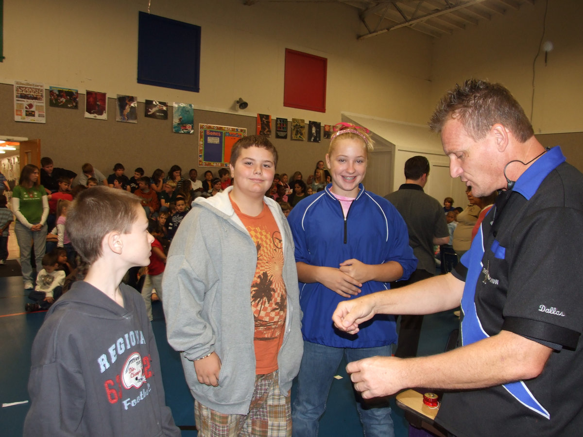 Image: Lets string a yo-yo — Damon Murdock, Kelton Bales and Jaclynn Lewis were selected to help others with stringing their yo-yo’s.