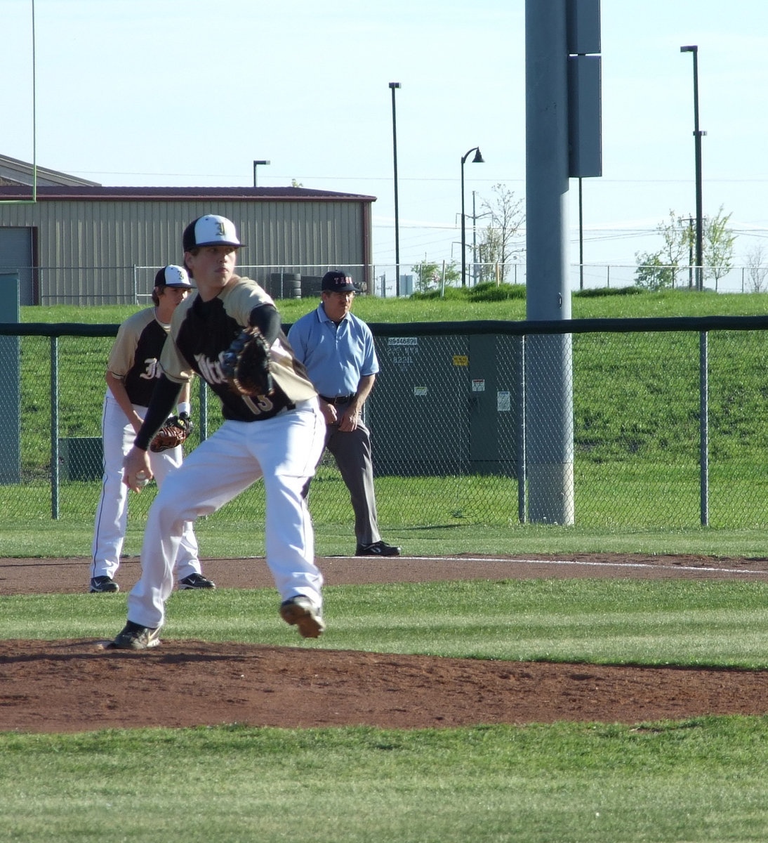 Image: Bringing the heat — Sophomore Justin Buchanan (district MVP) captures his opponent’s attention by throwing heat.