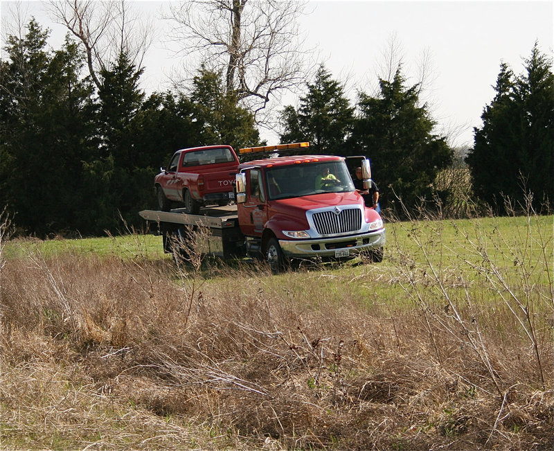 Image: Helms Garage tows truck away