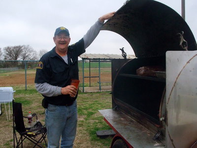 Image: Don and his Brisket — Don is with the Dallas Fire Department and is showing off his brisket.
